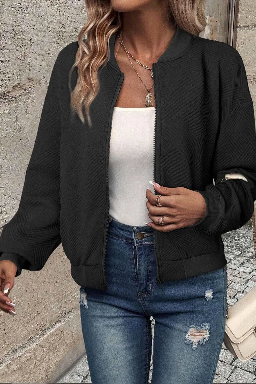 Sleek black bomber jacket with stand neck