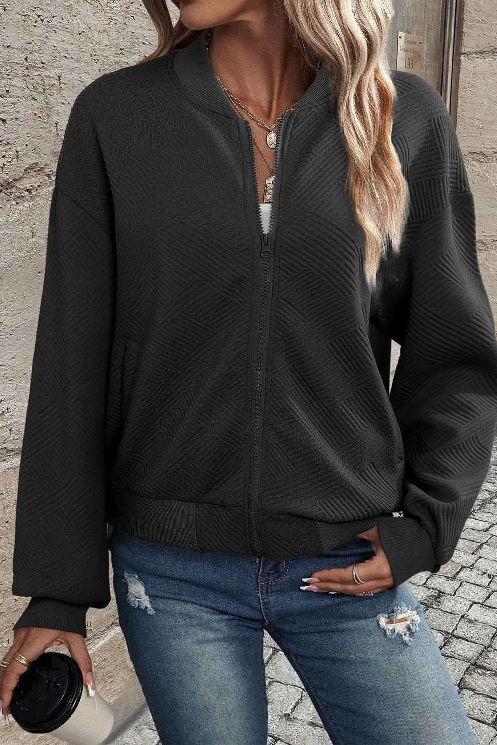 Sleek black bomber jacket with stand neck